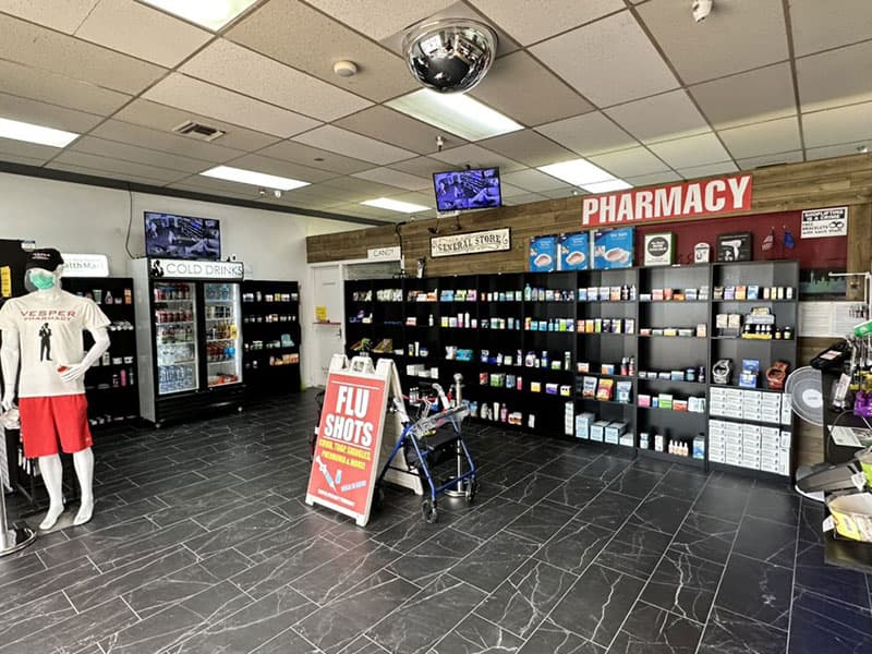 Inside the pharmacy: aisles, coolers and the pharmacy counter